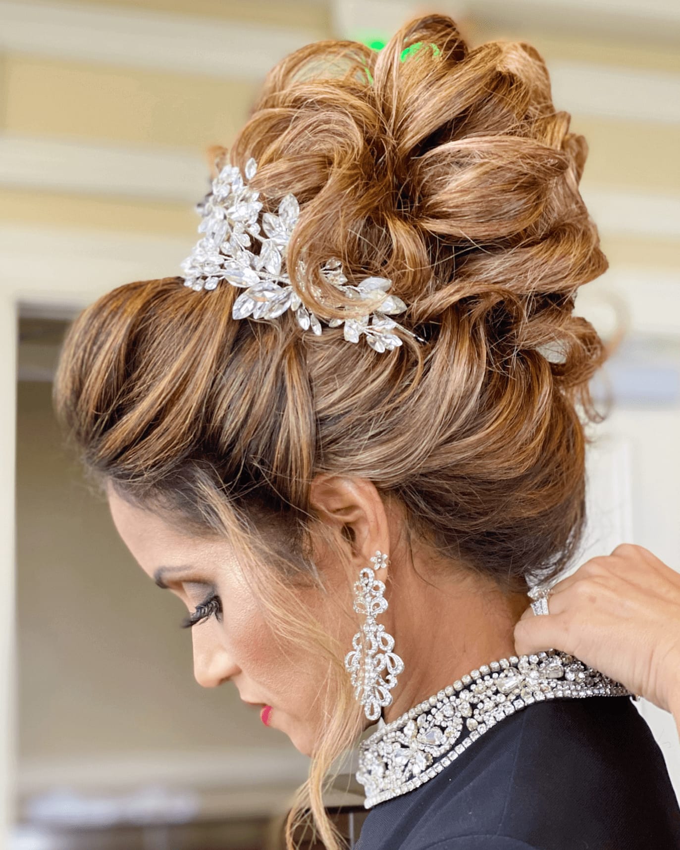 Caramel bridal updo with crystal hairpiece