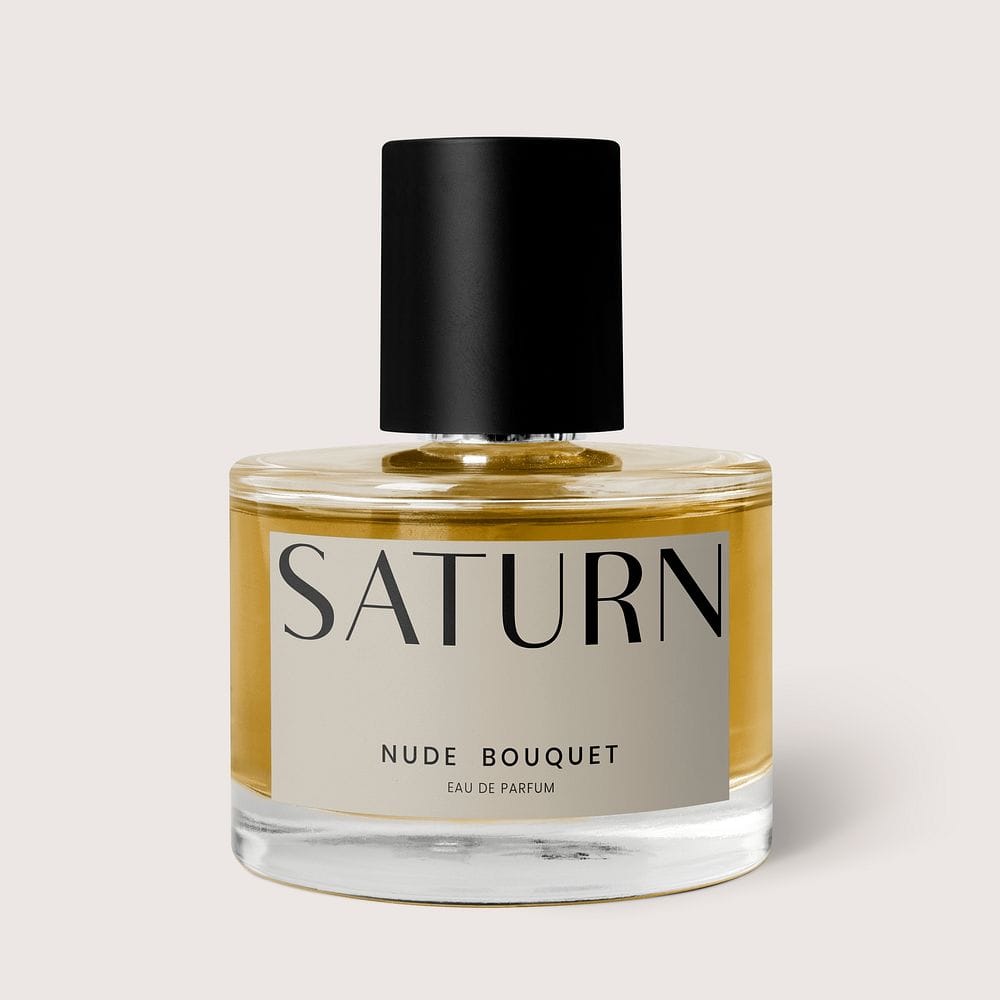 The Maison Belle N°9 flacon — a minimalist glass bottle on a beige background